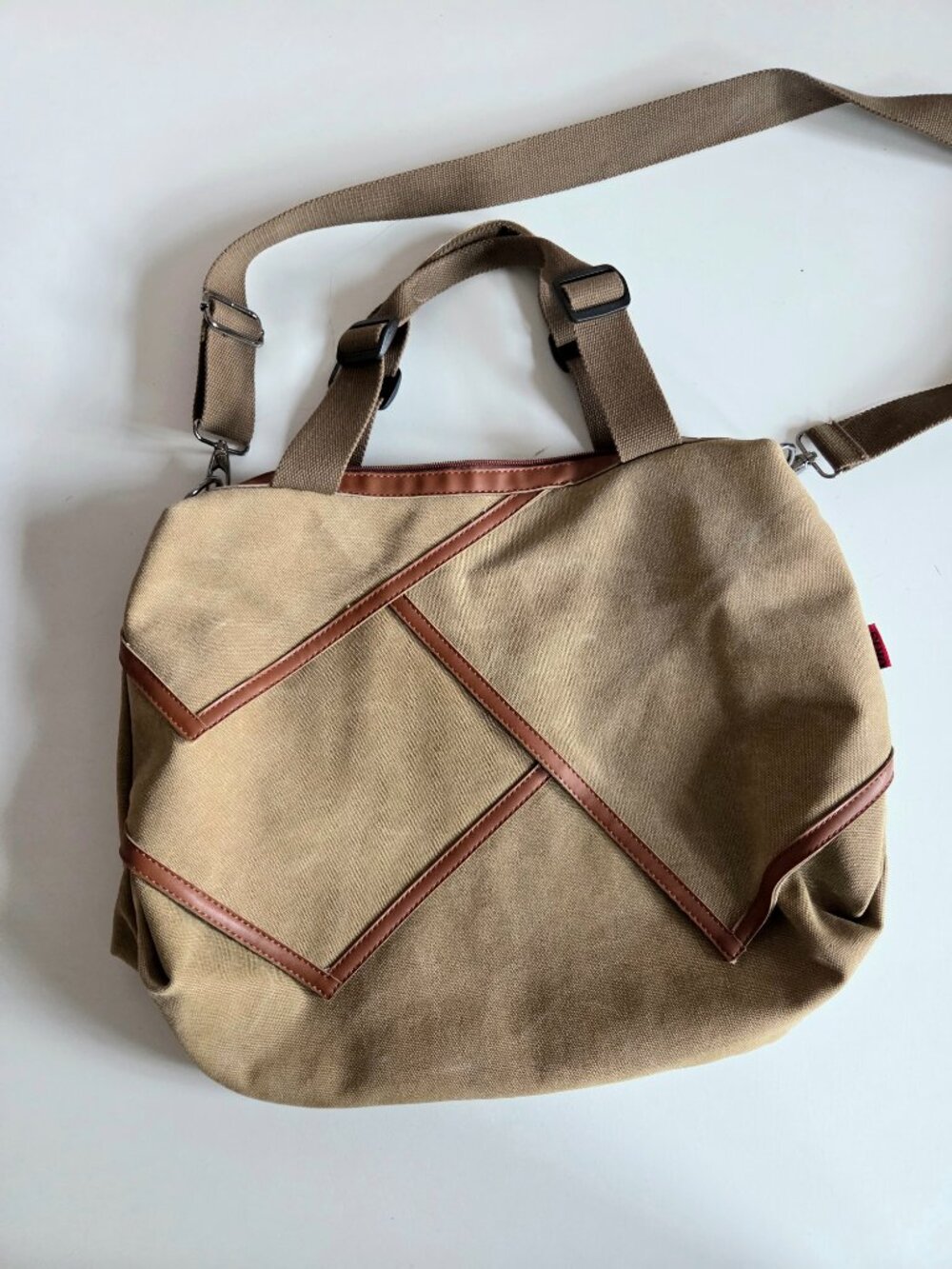 Oris large canvas crossbody bag with leather details.